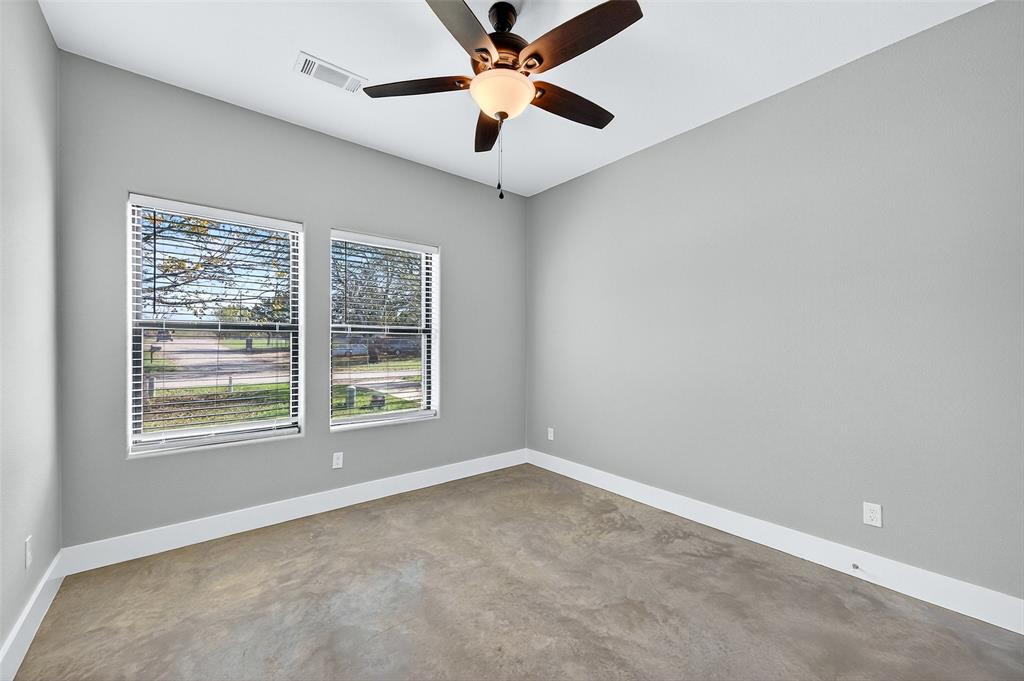 1431 South 7th Avenue Denison, TX 75021 - Photo 18 of 21 a view of an empty room with a window