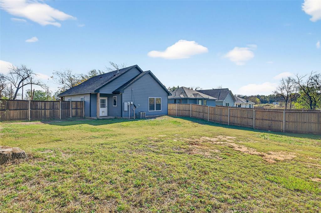 1431 South 7th Avenue Denison, TX 75021 - Photo 19 of 21 a view of a house with a swimming pool