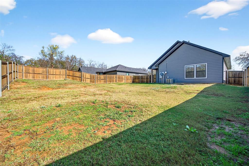 1431 South 7th Avenue Denison, TX 75021 - Photo 21 of 21 a view of an house with backyard and swimming pool