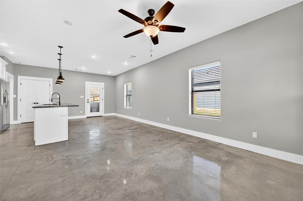 1431 South 7th Avenue Denison, TX 75021 - Photo 5 of 21 a view of an empty room with a kitchen