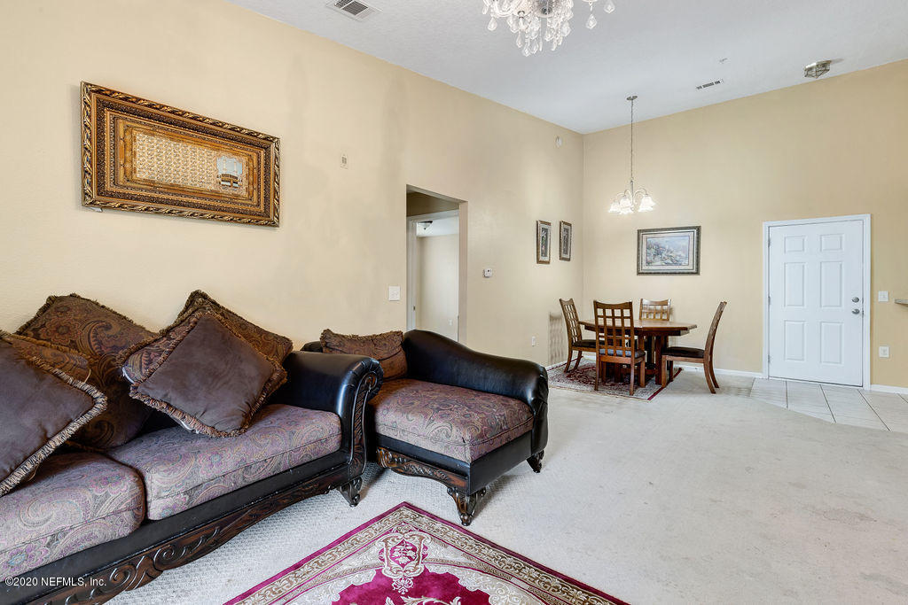 7920 Merrill Road, Unit 2110 Jacksonville, FL 32277 - Photo 11 of 20 Living Room/Dining