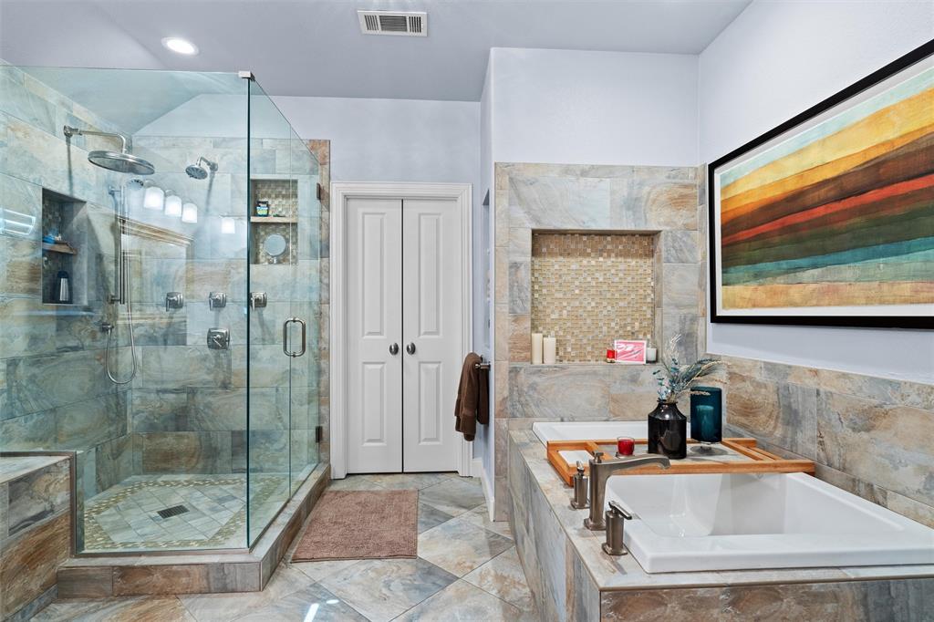 4931 Milam Street Dallas, TX 75206 - Photo 18 of 30 a bathroom with a tub sink mirror and shower