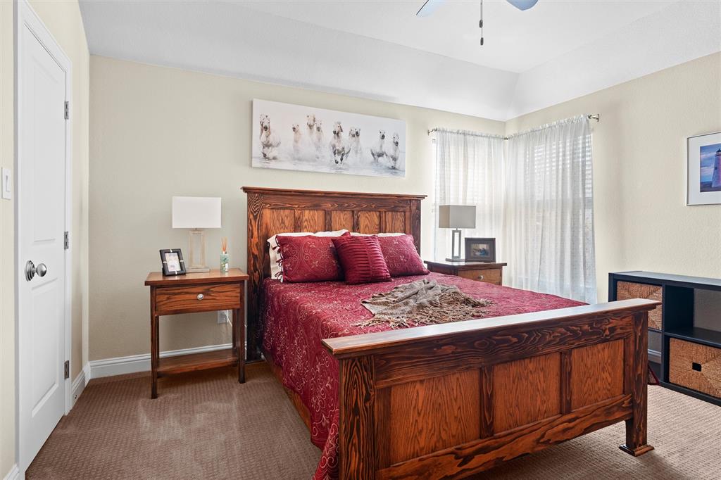 4931 Milam Street Dallas, TX 75206 - Photo 19 of 30 a bedroom with a bed and a dresser