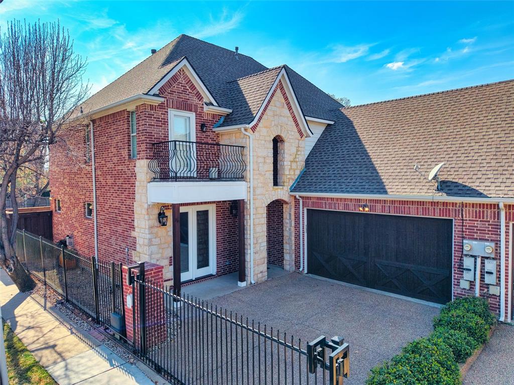 4931 Milam Street Dallas, TX 75206 - Photo 2 of 30 a front view of a house with garage