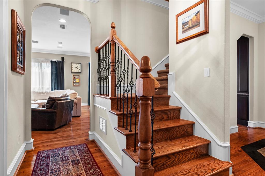 4931 Milam Street Dallas, TX 75206 - Photo 3 of 30 a view of entryway and hall with wooden floor