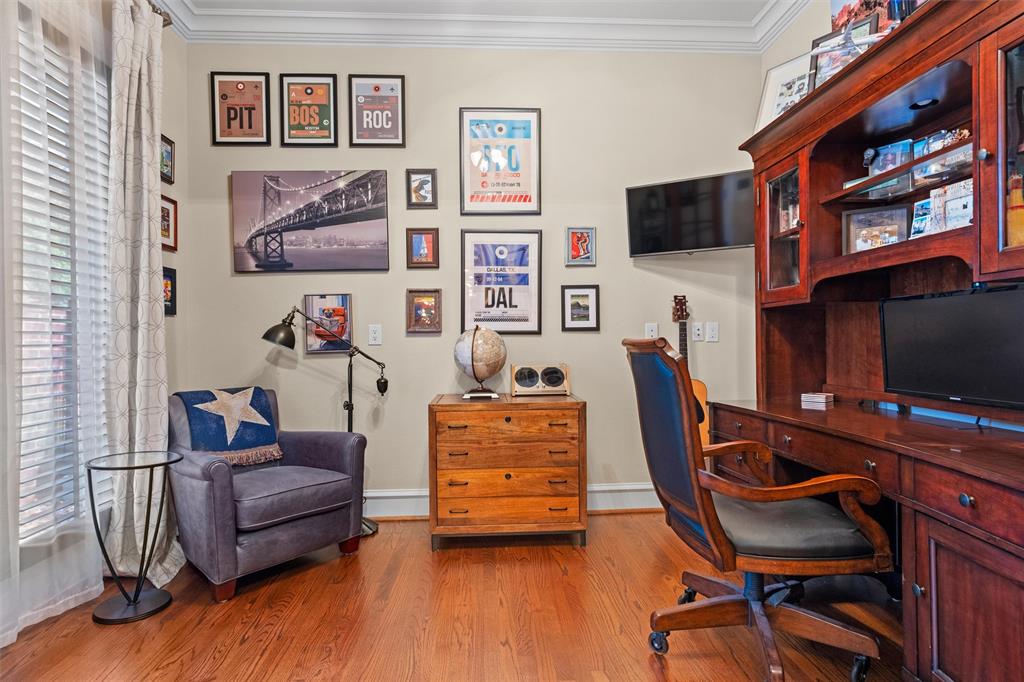 4931 Milam Street Dallas, TX 75206 - Photo 5 of 30 a view of a livingroom with furniture and a flat screen tv