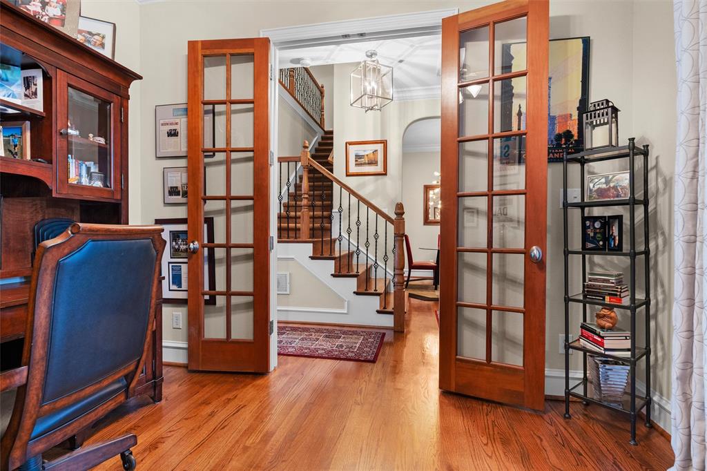 4931 Milam Street Dallas, TX 75206 - Photo 6 of 30 a view of front door deck and hall with wooden floor