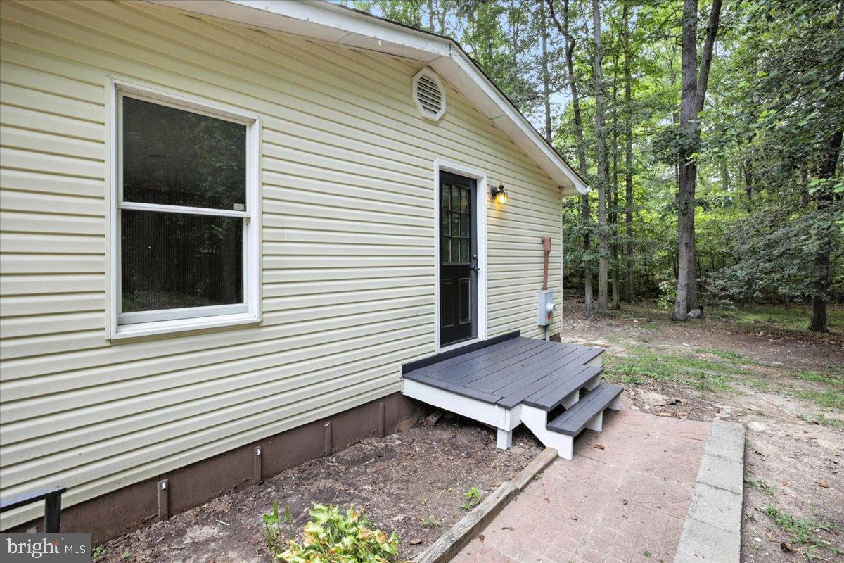 7102 Tanglewood Road Spotsylvania, VA 22551 - Photo 24 of 26 Charming home nestled in serene greenery.