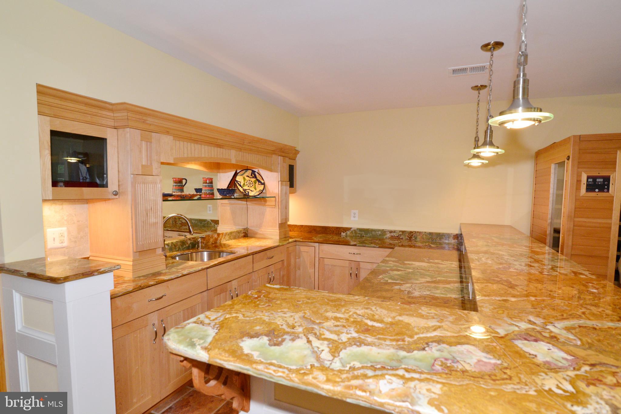 2268 Cedar Cove Court Reston, VA 20191 - Photo 31 of 41 The wet bar has granite counters & a raised ledge.