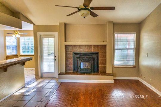 512 Amanda Street Ridgecrest, CA 93555 - Photo 17 of 44 a view of a livingroom with a fireplace and window