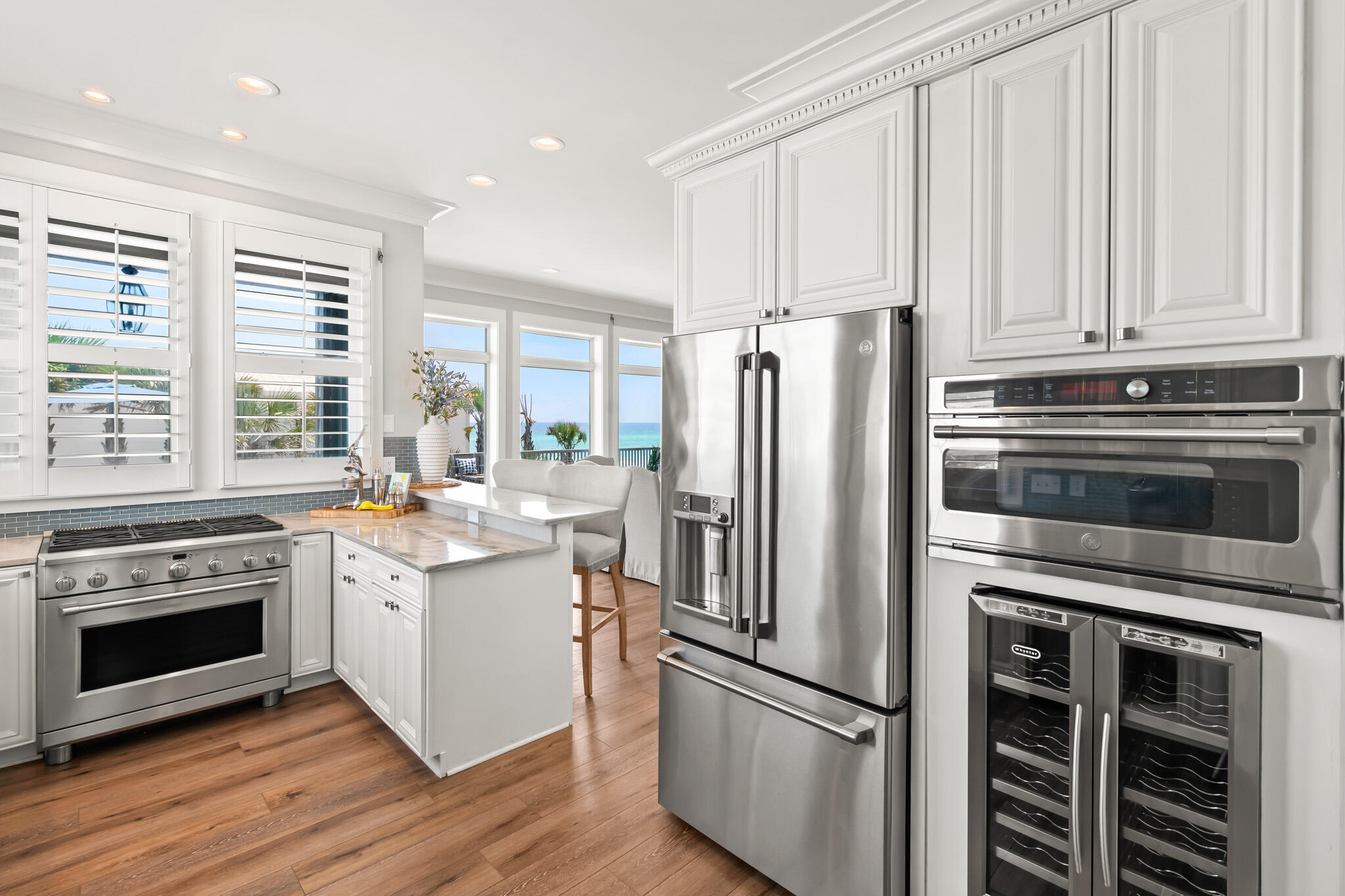 15 Fort Panic Road Santa Rosa Beach, FL 32459 - Photo 42 of 84 a kitchen with stainless steel appliances a stove a refrigerator and a window