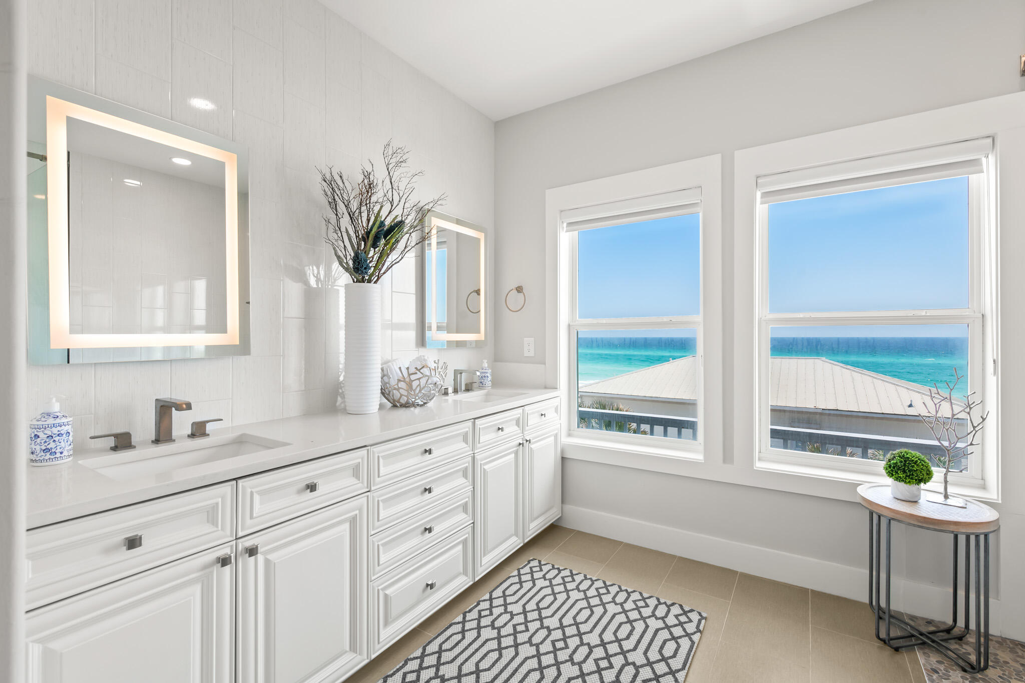 15 Fort Panic Road Santa Rosa Beach, FL 32459 - Photo 65 of 84 a bathroom with a granite countertop sink a mirror and a bathtub