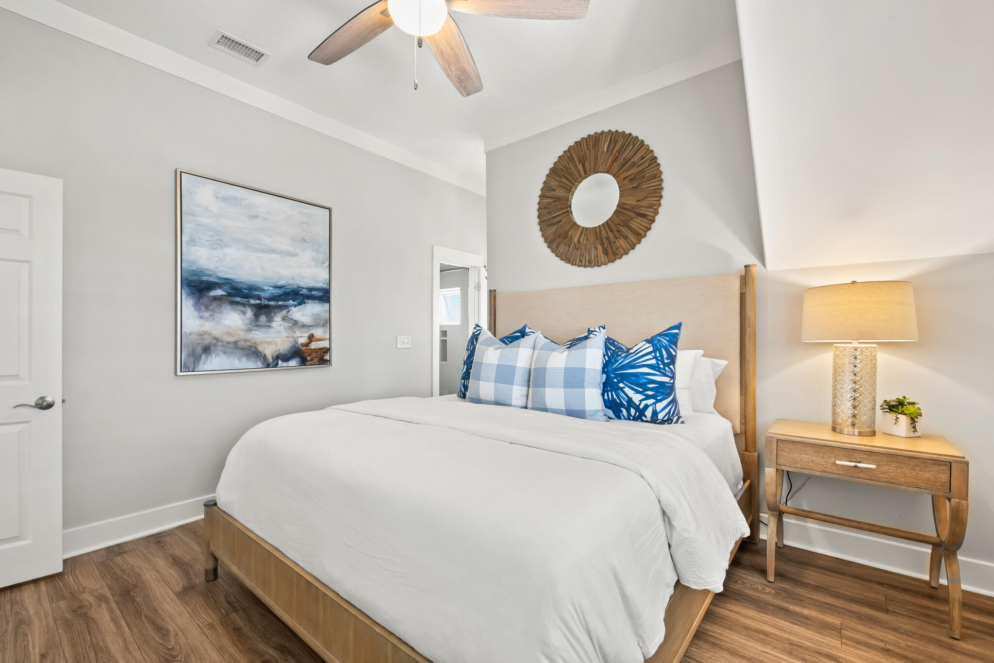 15 Fort Panic Road Santa Rosa Beach, FL 32459 - Photo 69 of 84 a bedroom with a bed and a lamp on dresser