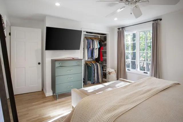 a view of living room with furniture and book shelf