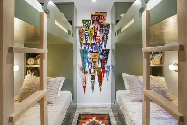 a bedroom with a bed furniture and a book shelf
