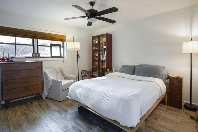 a outdoor space with furniture a flat screen tv and a fireplace