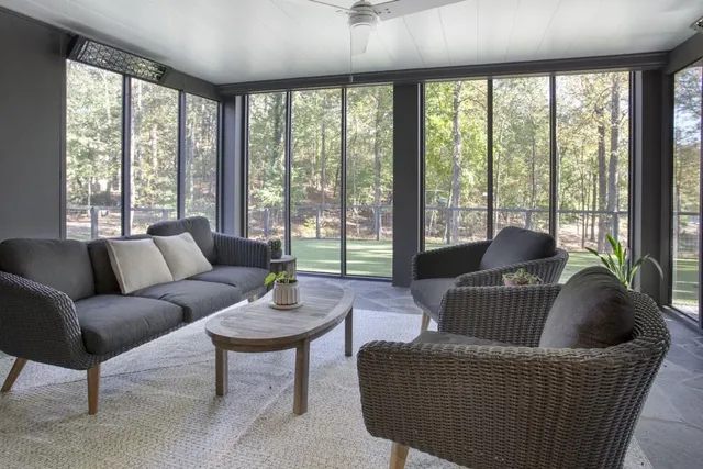 a backyard of a house with table and chairs