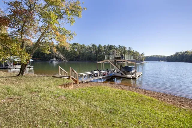a view of a lake with boats and a bridge