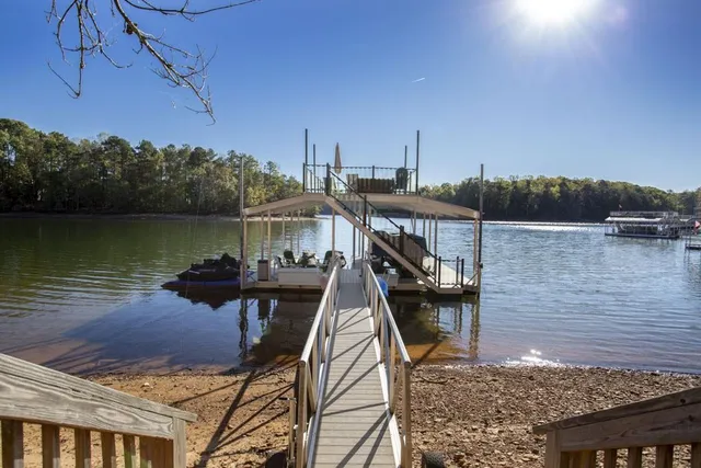 a view of a lake with a house in the background
