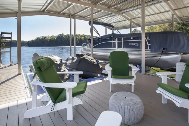 a view of a wooden deck with furniture