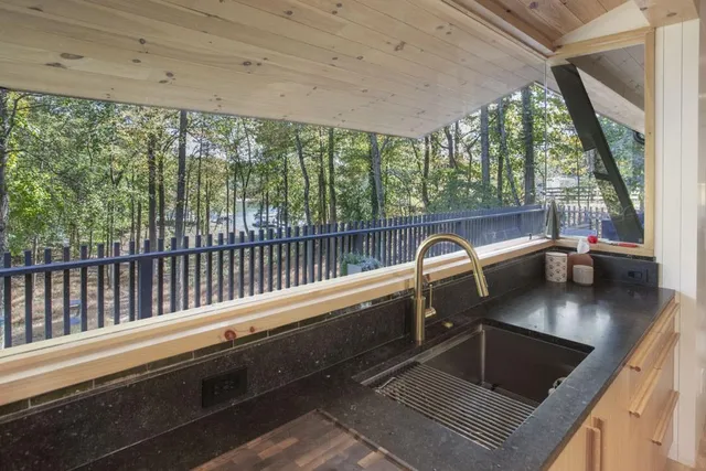 a outdoor dining space with furniture and wooden floor