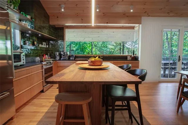 a view of a dining room with furniture window and outside view