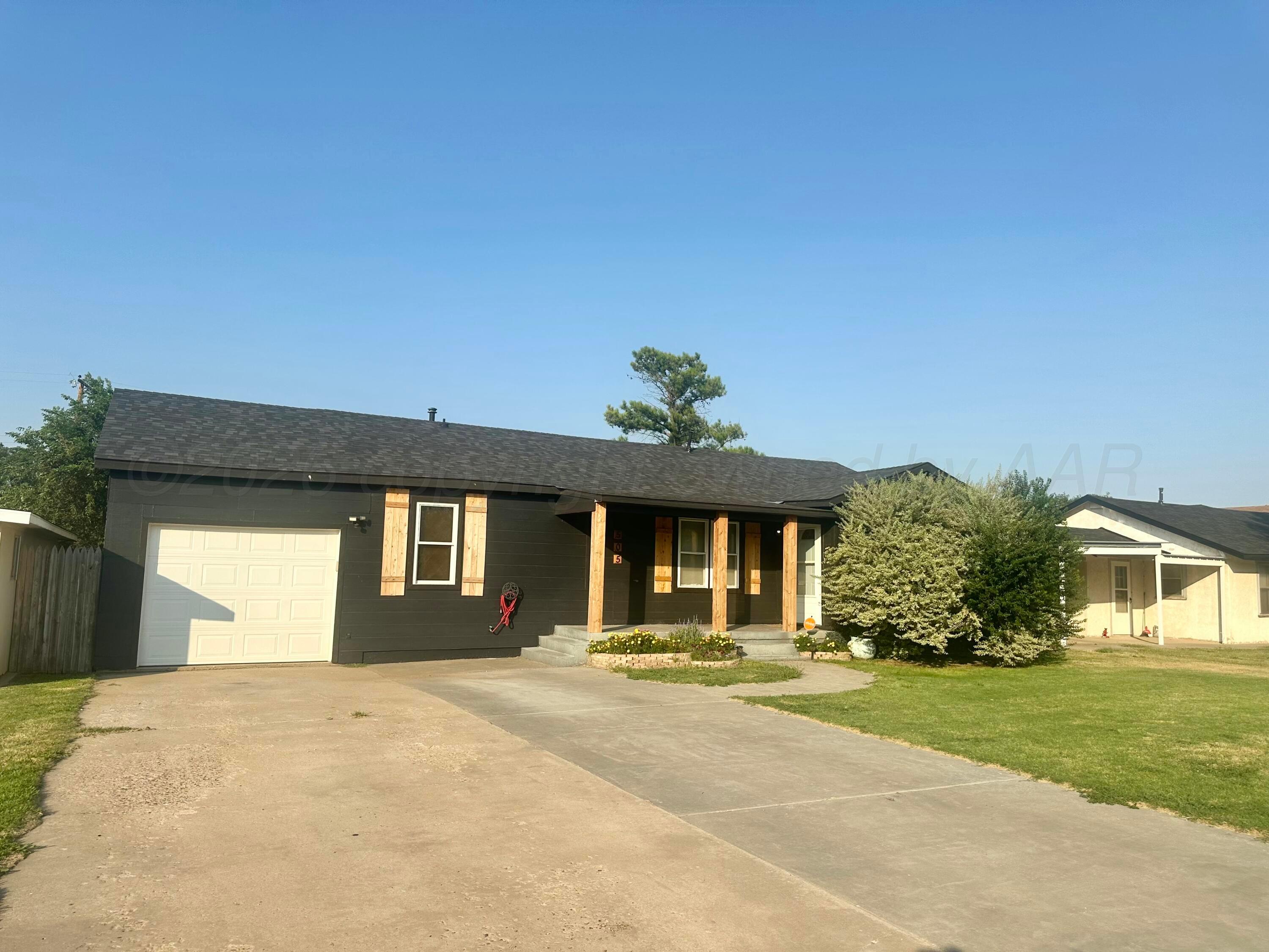 505 South Ridgeland Avenue Fritch, TX 79036 - Photo 18 of 19 a front view of a house with a yard
