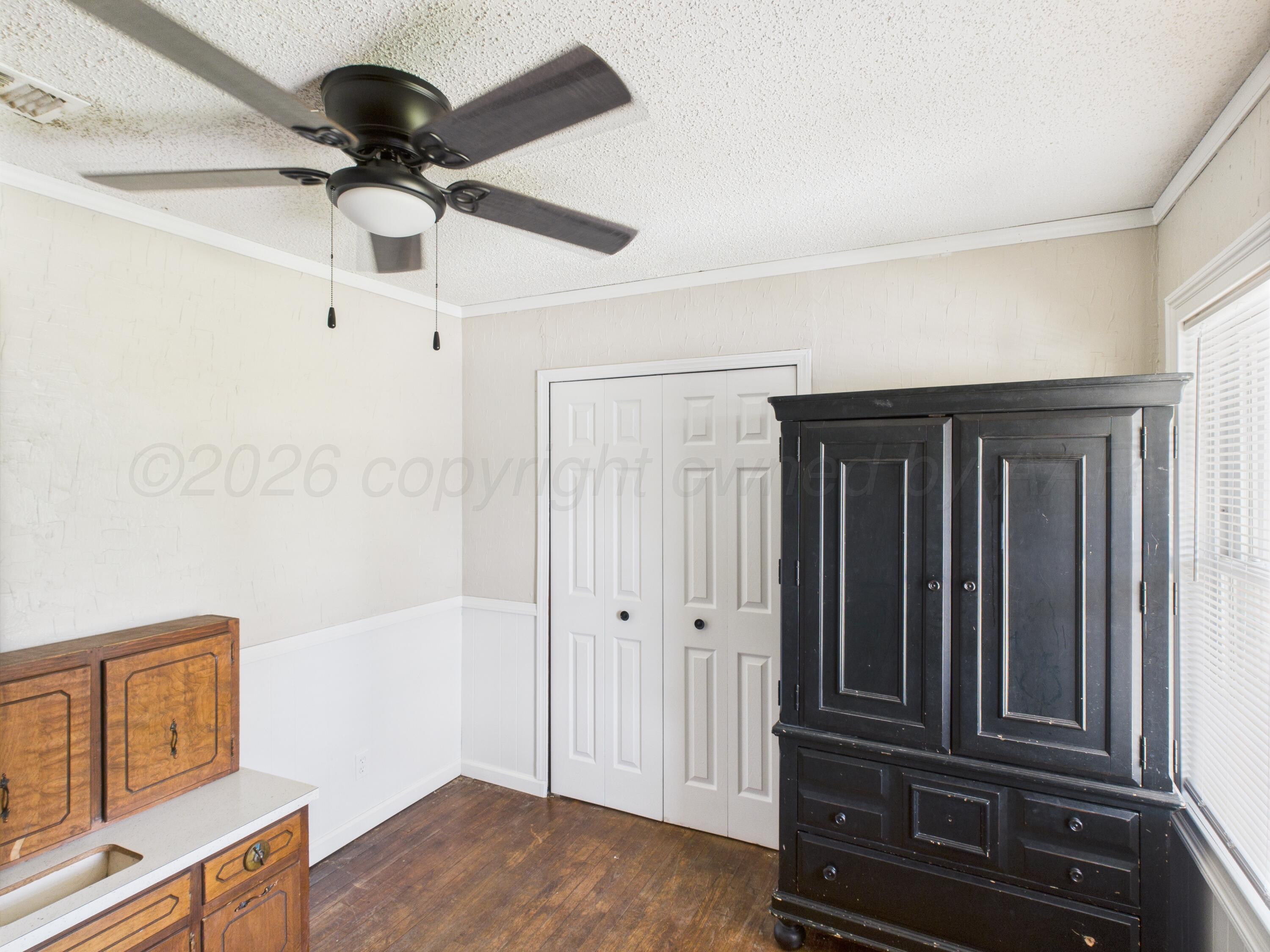 505 South Ridgeland Avenue Fritch, TX 79036 - Photo 7 of 19 wooden floor in an empty room