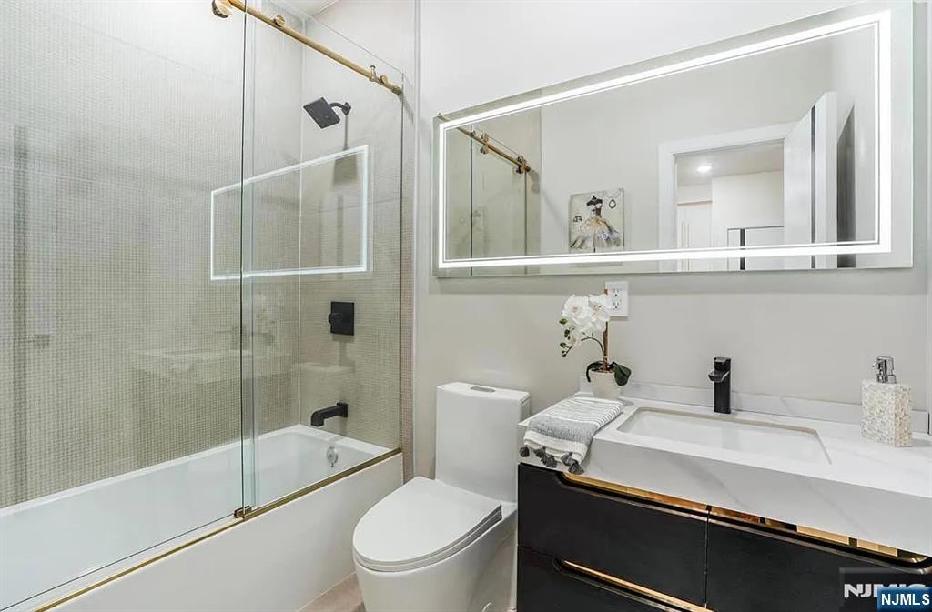 210 22nd Street, Unit 2 Irvington, NJ 07111 - Photo 12 of 20 a bathroom with a sink a toilet and shower