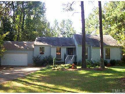 9817 Gralyn Road Raleigh, NC 27613 - Photo 1 of 1 a front view of a house with a yard and garage