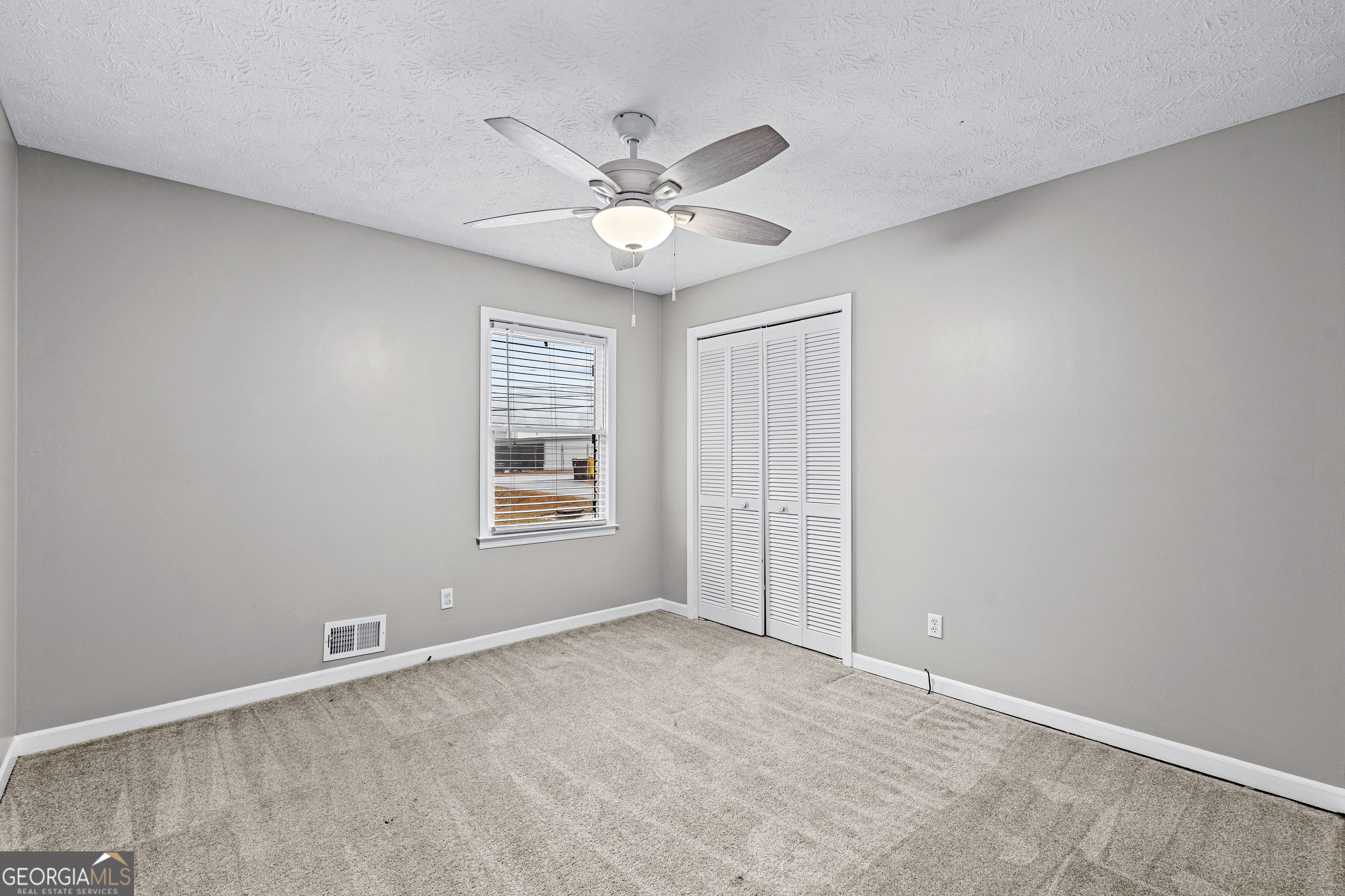 96 Poplar Road Newnan, GA 30263 - Photo 19 of 33 a view of an empty room with a window