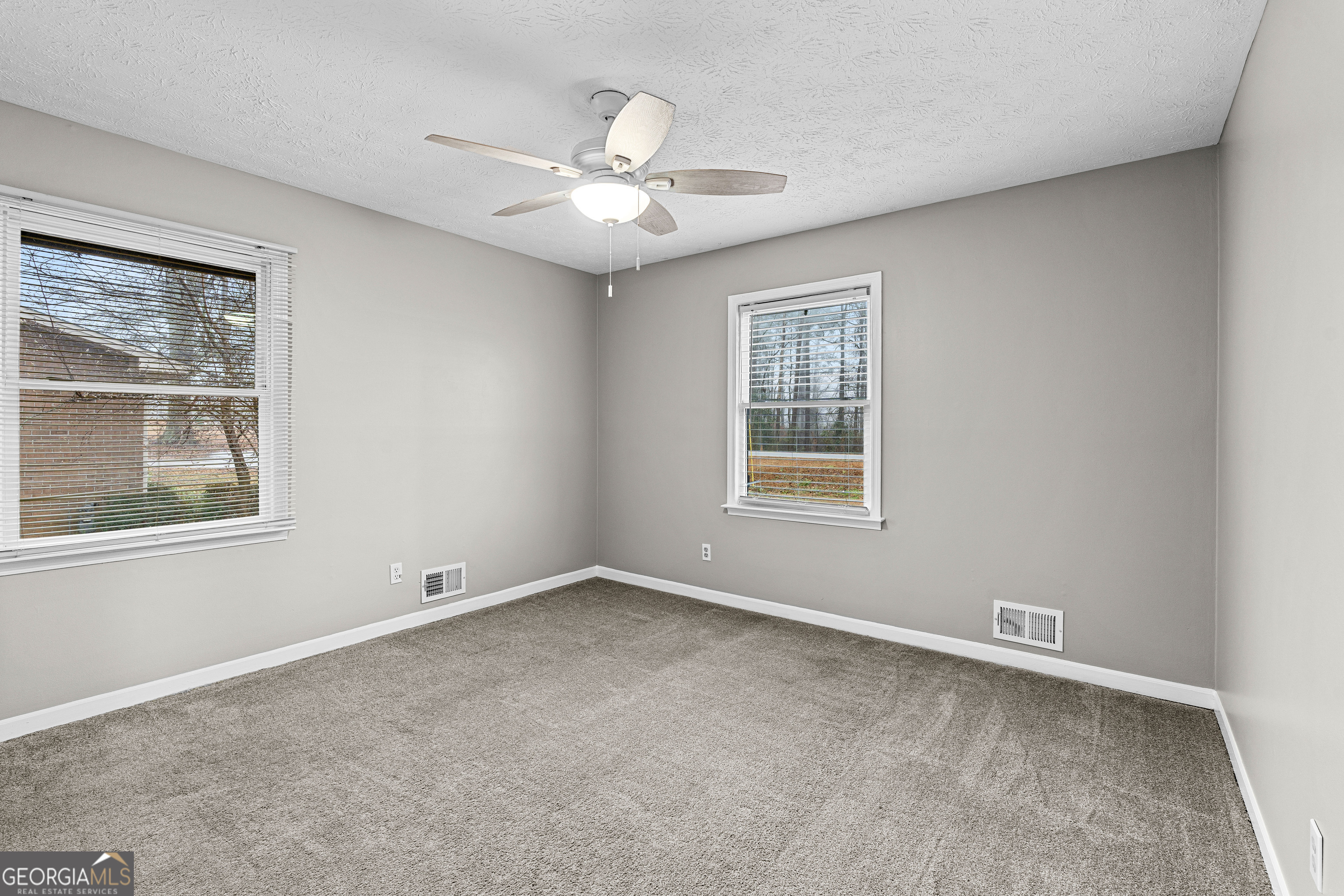 96 Poplar Road Newnan, GA 30263 - Photo 21 of 33 a view of an empty room with a window