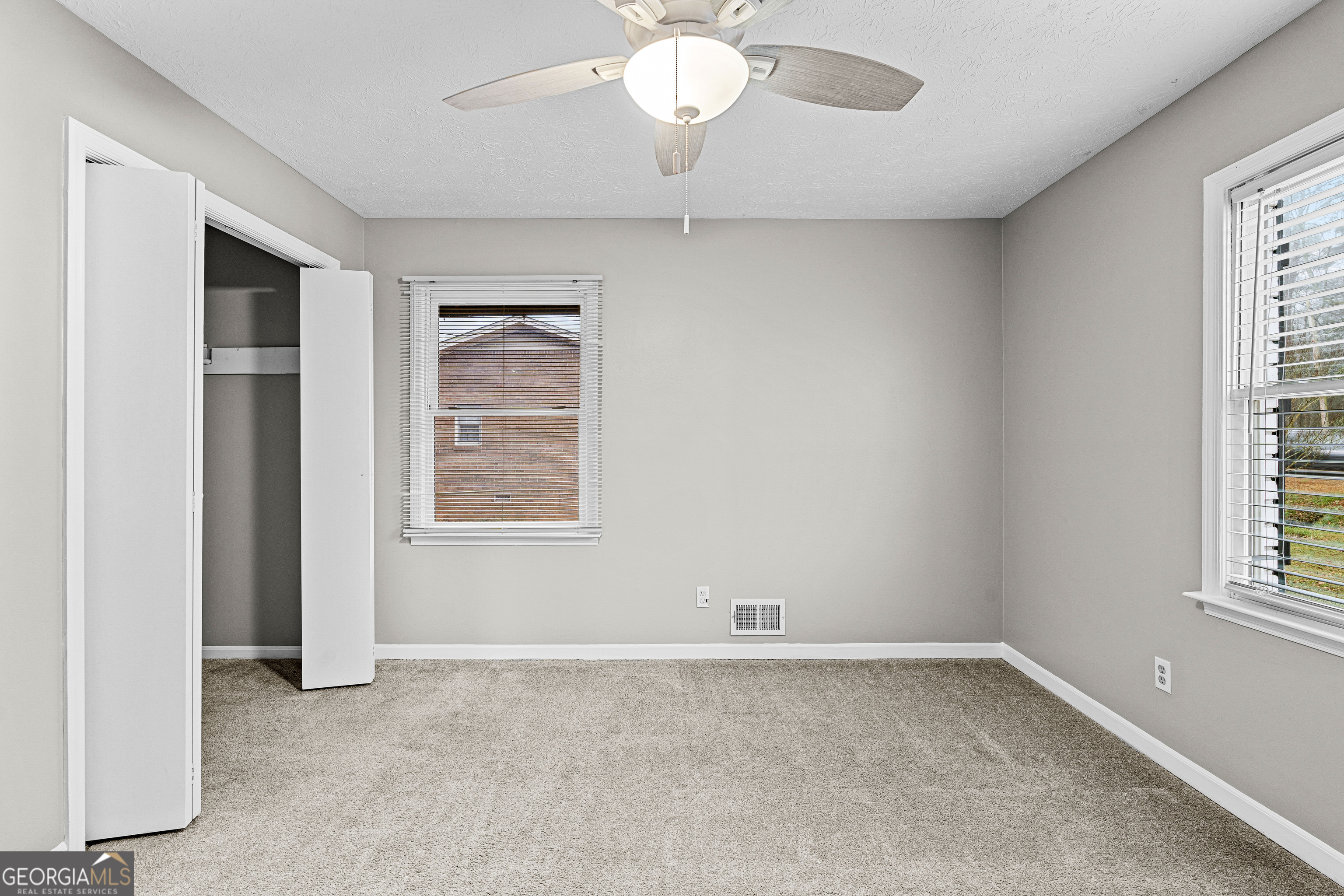 96 Poplar Road Newnan, GA 30263 - Photo 22 of 33 an empty room with a window