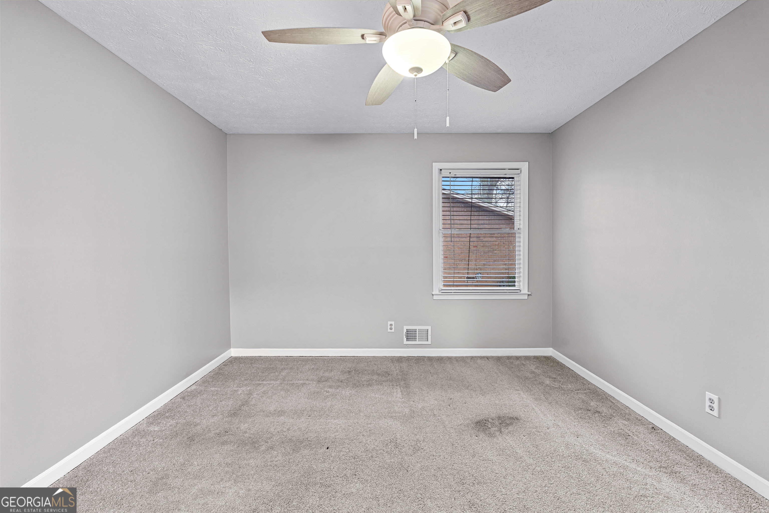 96 Poplar Road Newnan, GA 30263 - Photo 24 of 33 an empty room with a window