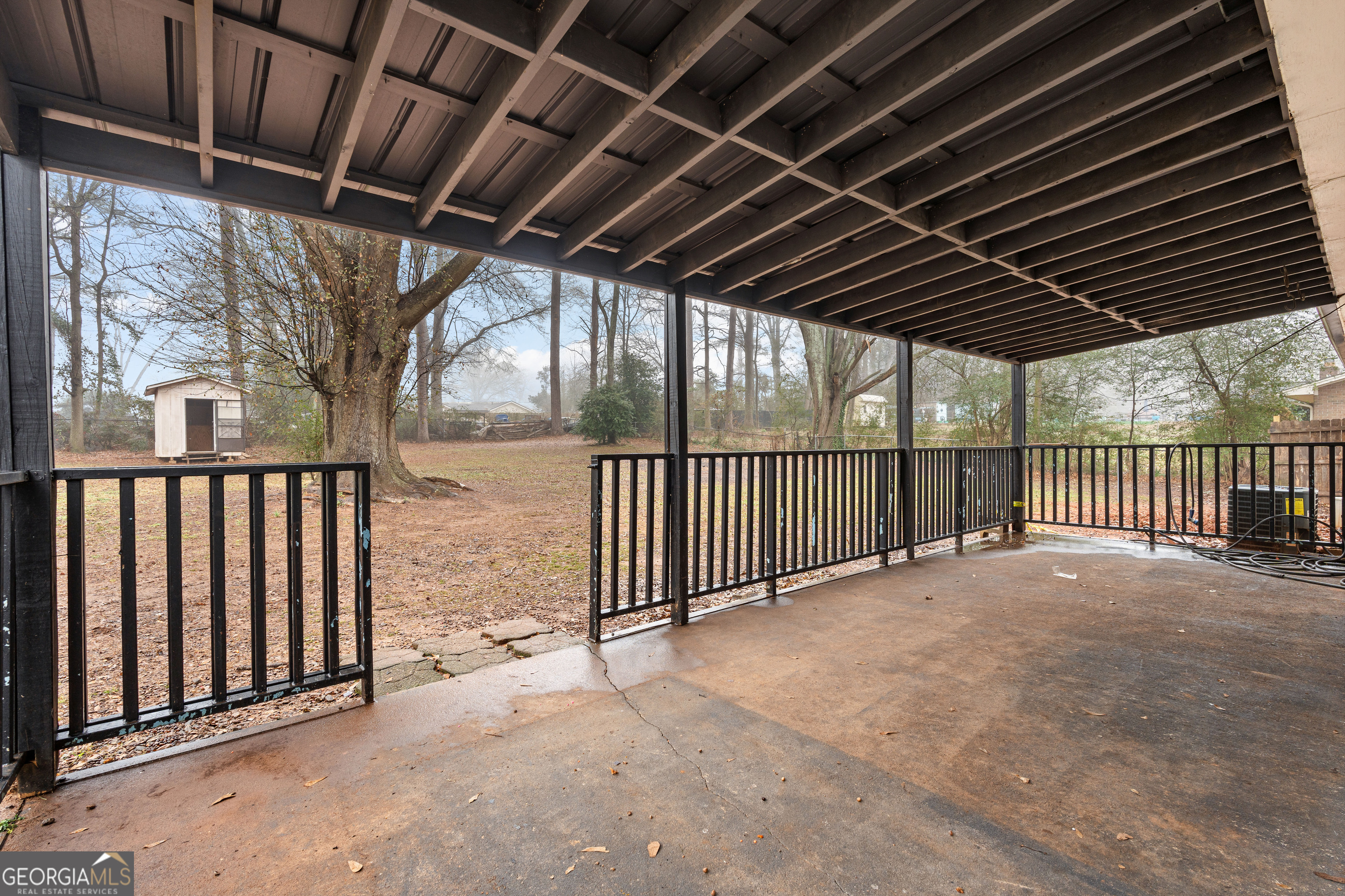 96 Poplar Road Newnan, GA 30263 - Photo 29 of 33 a view of a shaded area of porch