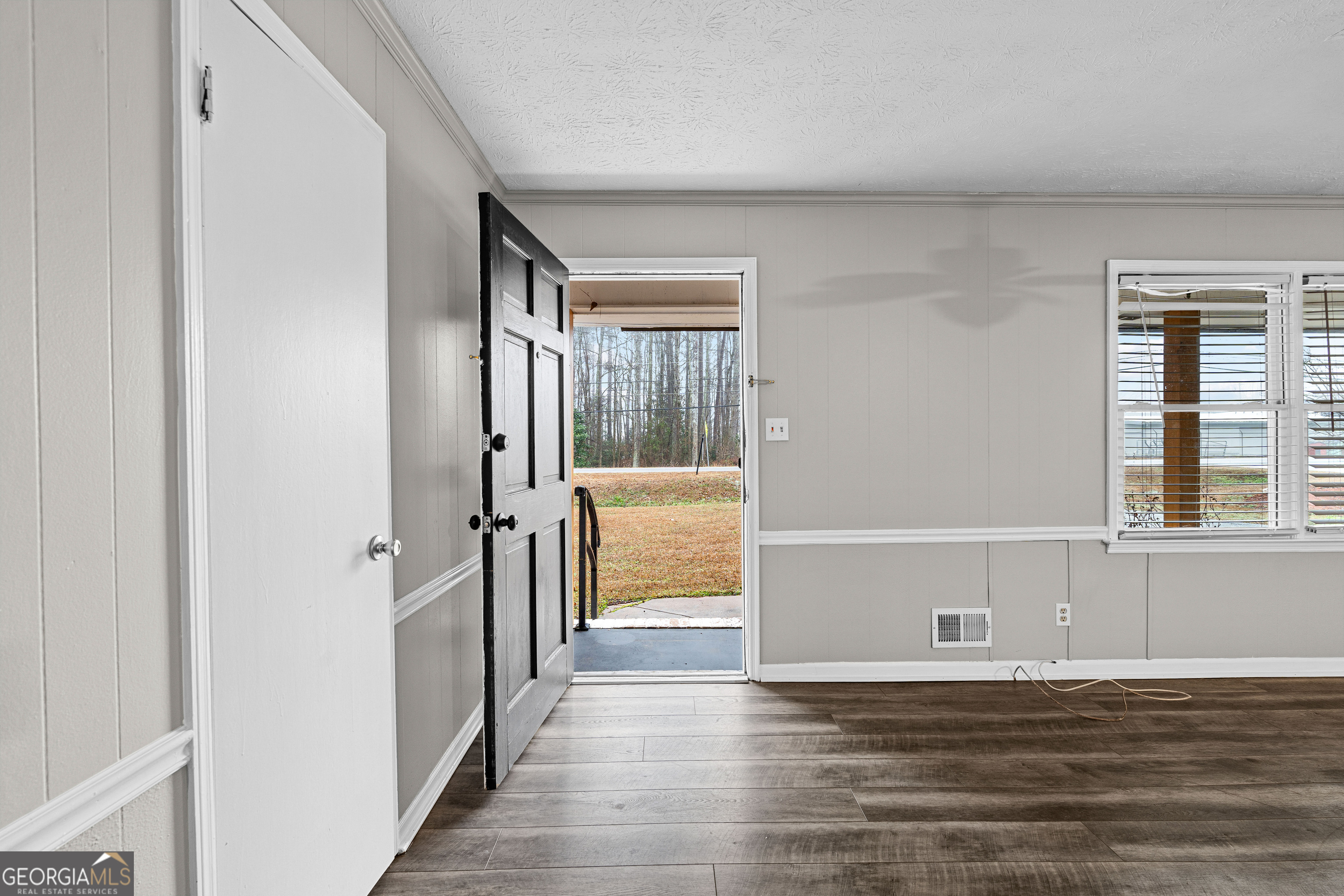 96 Poplar Road Newnan, GA 30263 - Photo 5 of 33 a view of a livingroom with wooden floor and a window