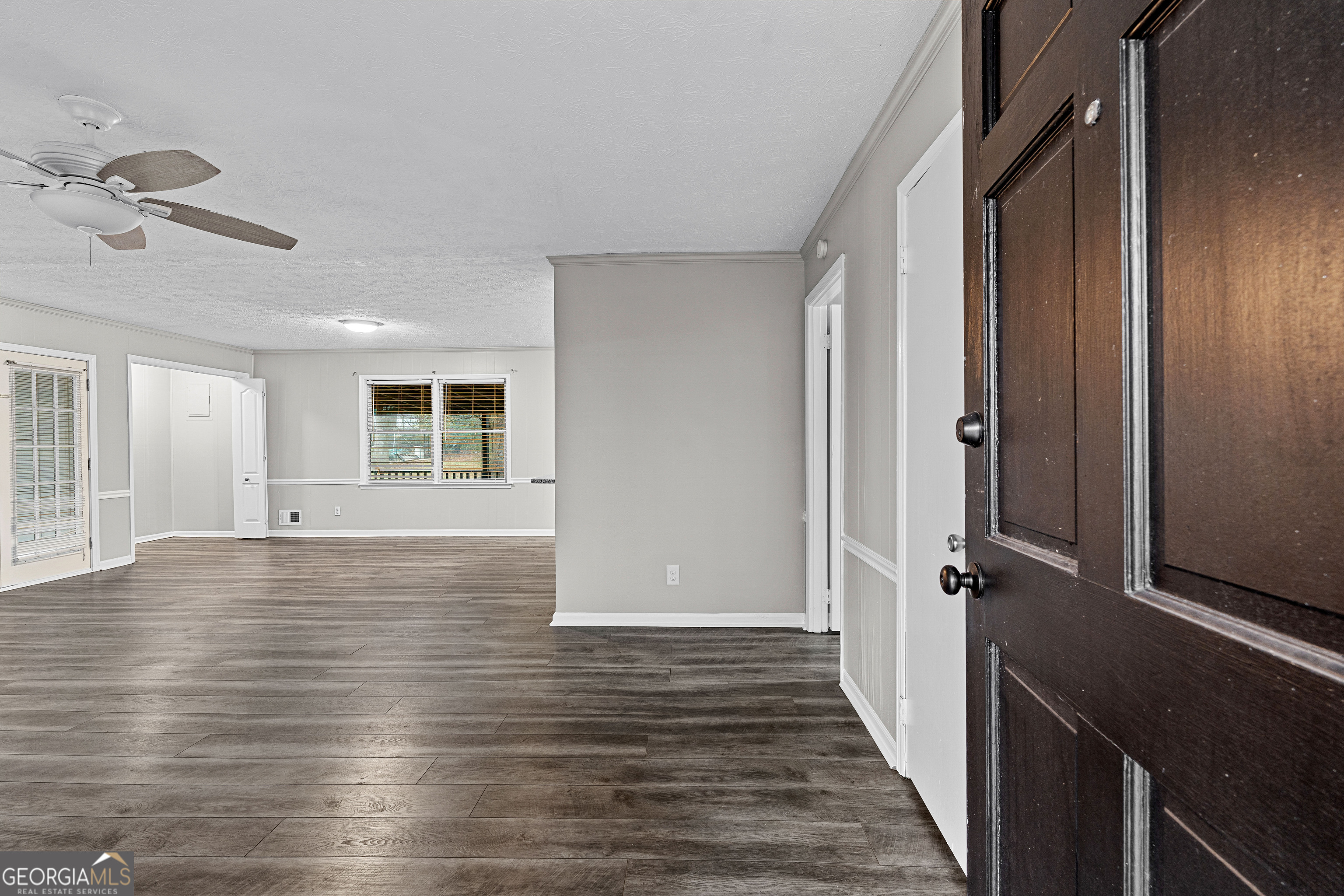 96 Poplar Road Newnan, GA 30263 - Photo 6 of 33 wooden floor in an empty room with a window