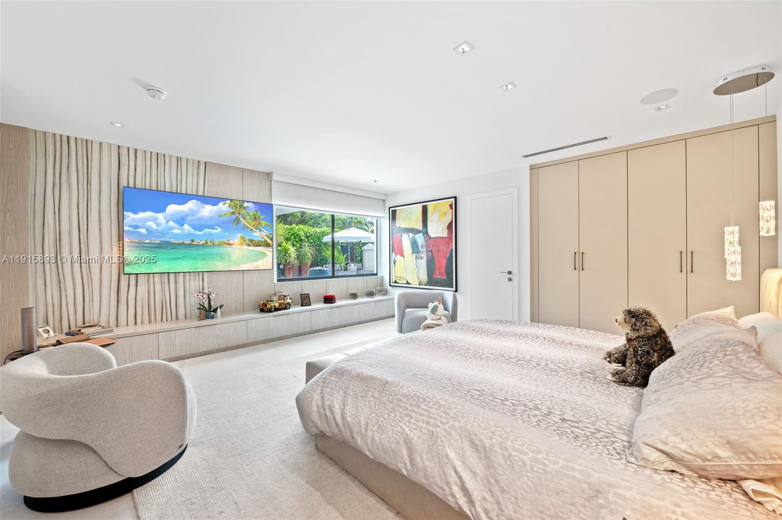 1792 Cleveland Road Miami Beach, FL 33141 - Photo 15 of 39 a bedroom with a large bed and a large window