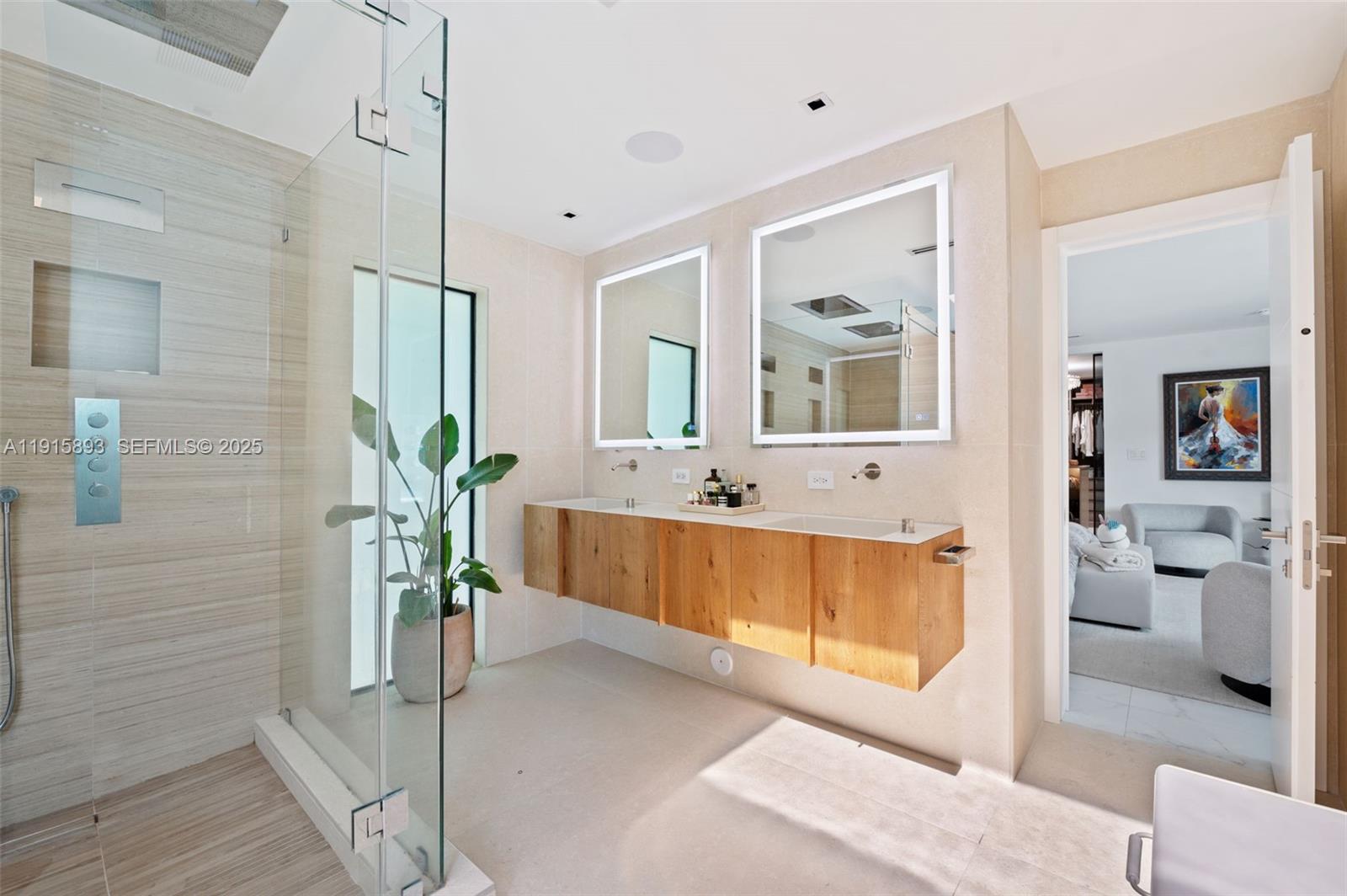1792 Cleveland Road Miami Beach, FL 33141 - Photo 16 of 39 a bathroom with a tub and a large mirror