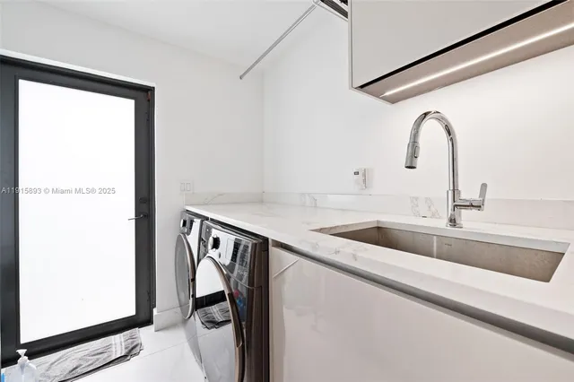 an aerial view of multiple houses with a yard