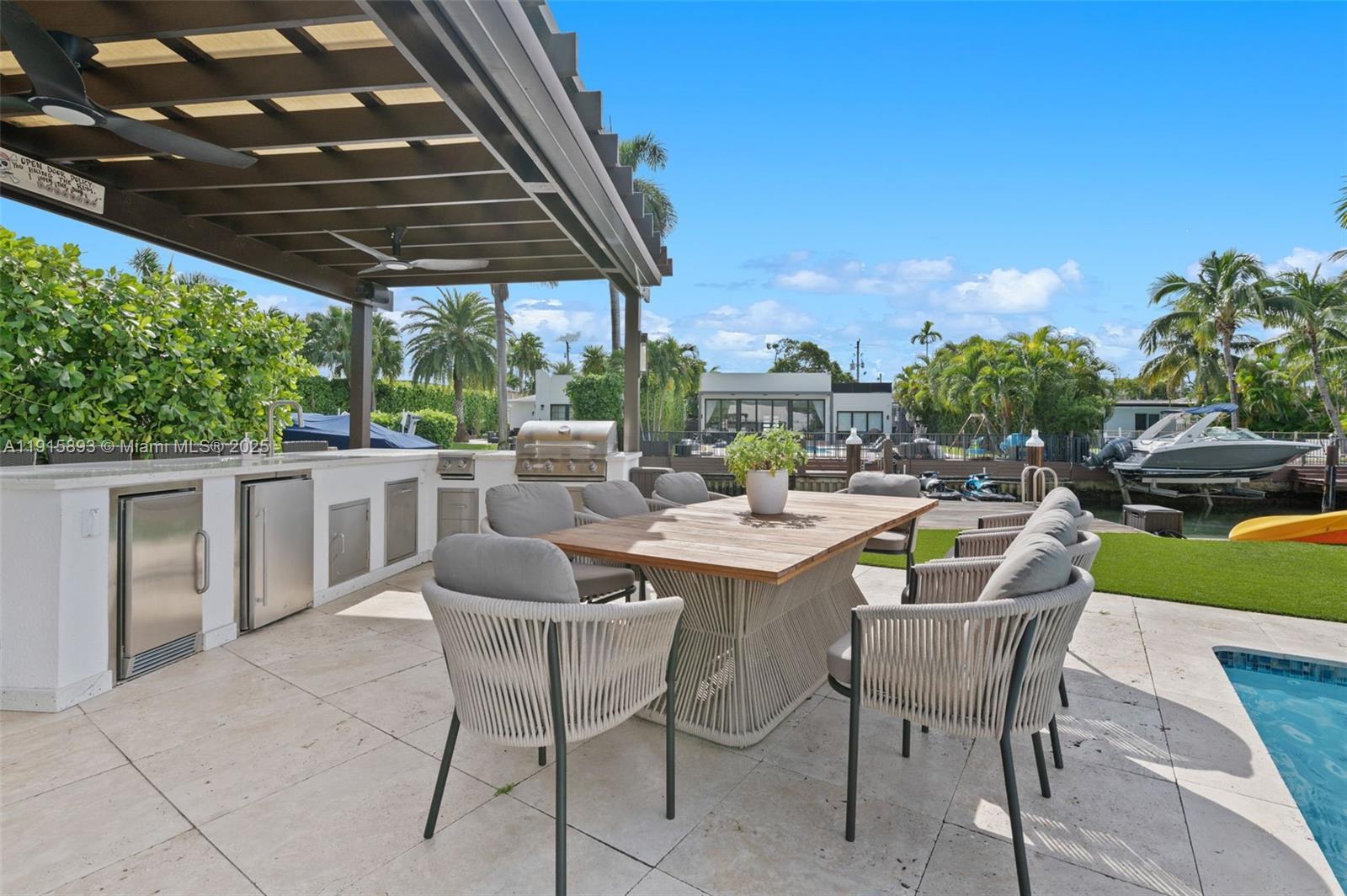 1792 Cleveland Road Miami Beach, FL 33141 - Photo 27 of 39 a patio with a patio table and chairs