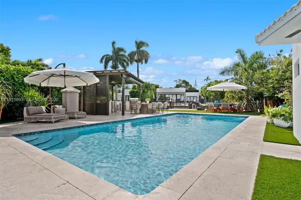 a view of a swimming pool with a patio