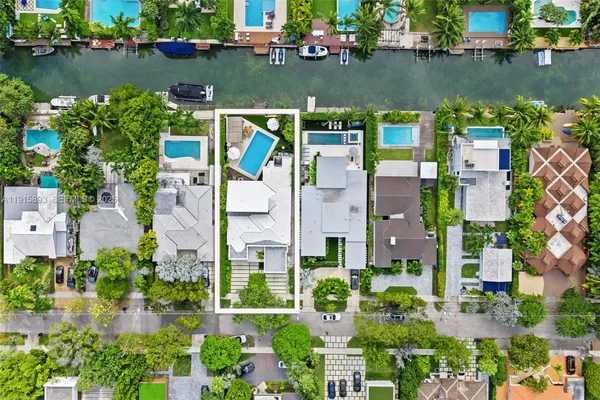 aerial view of a house with a lake view