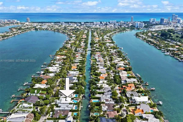 an aerial view of houses with yard