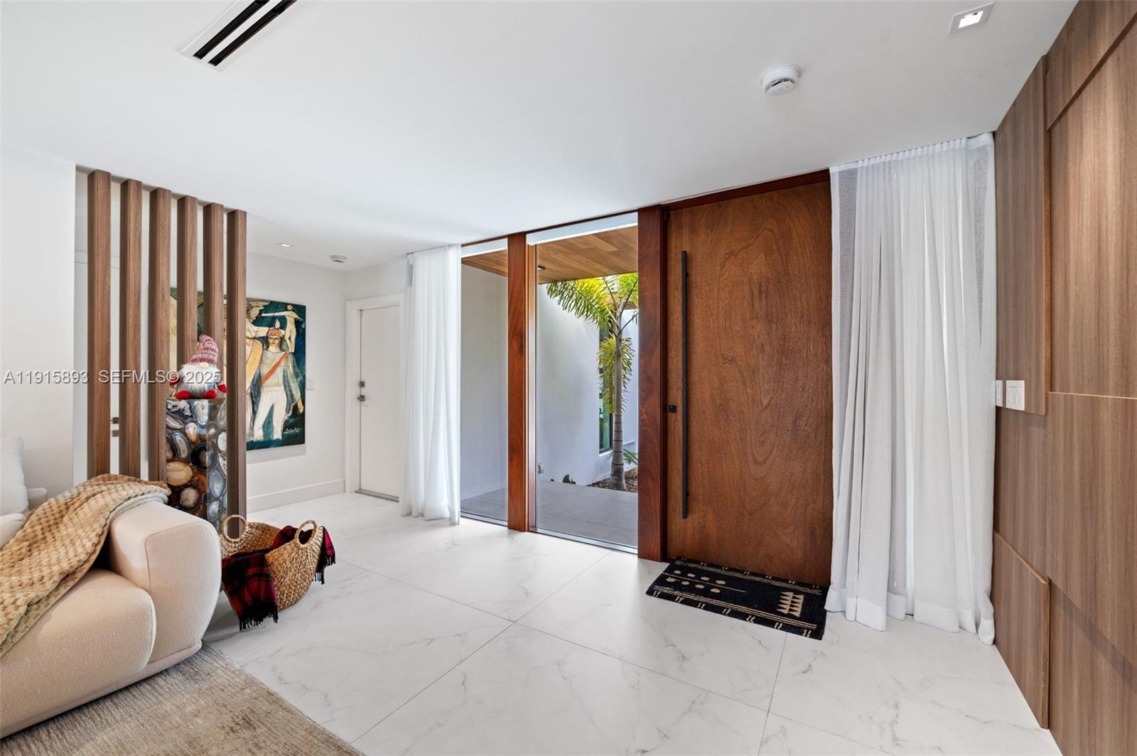 1792 Cleveland Road Miami Beach, FL 33141 - Photo 7 of 39 a bedroom with furniture and a window