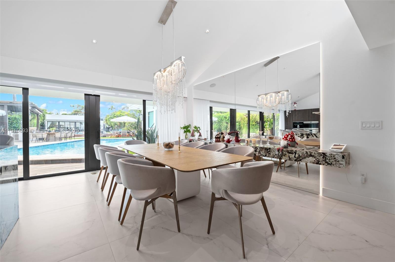 1792 Cleveland Road Miami Beach, FL 33141 - Photo 9 of 39 a dining room with furniture and a large window