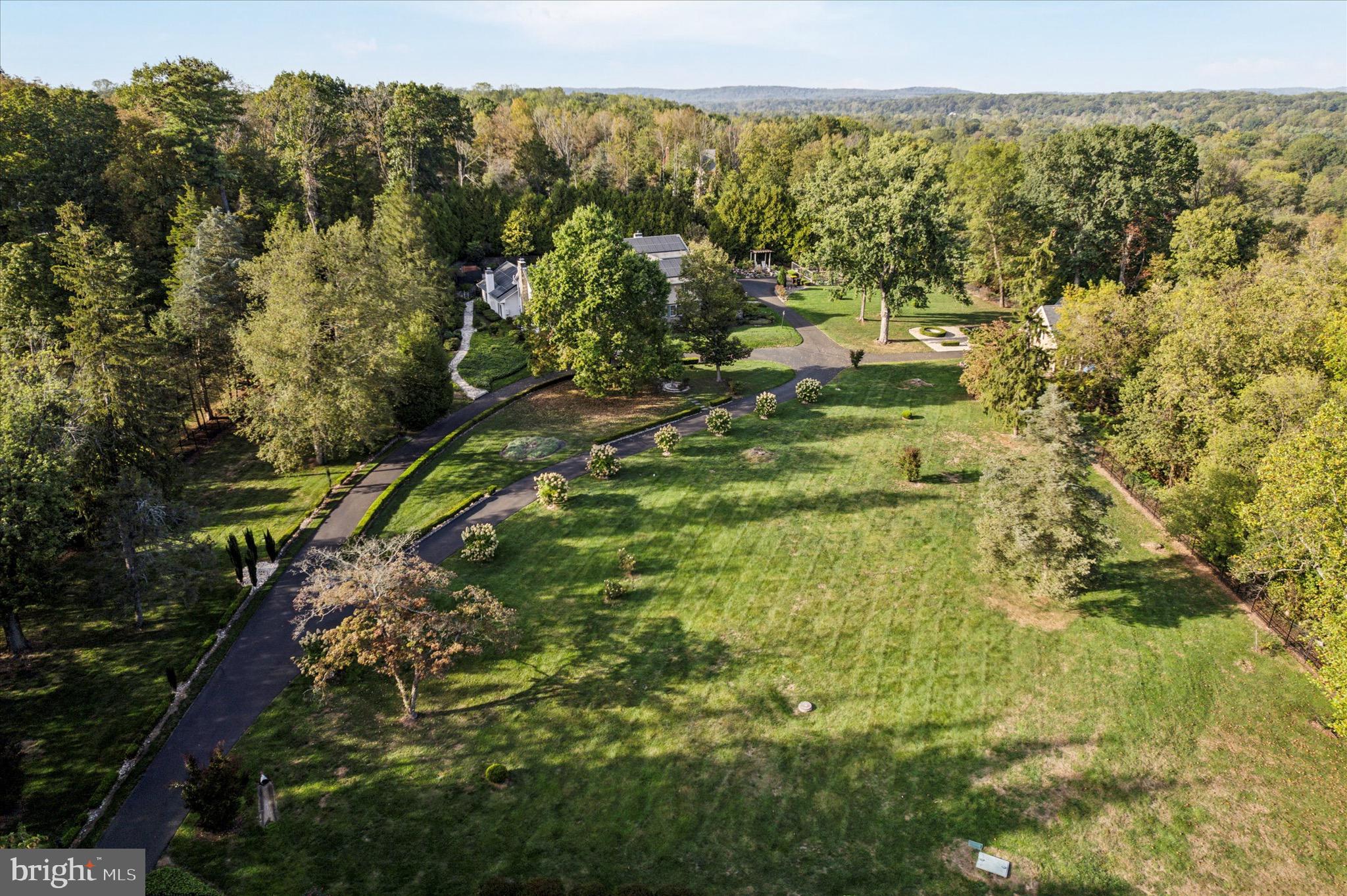 1087 Mt Eyre Road Washington Crossing, PA 18977 - Photo 20 of 77 a view of a forest with an outdoor space