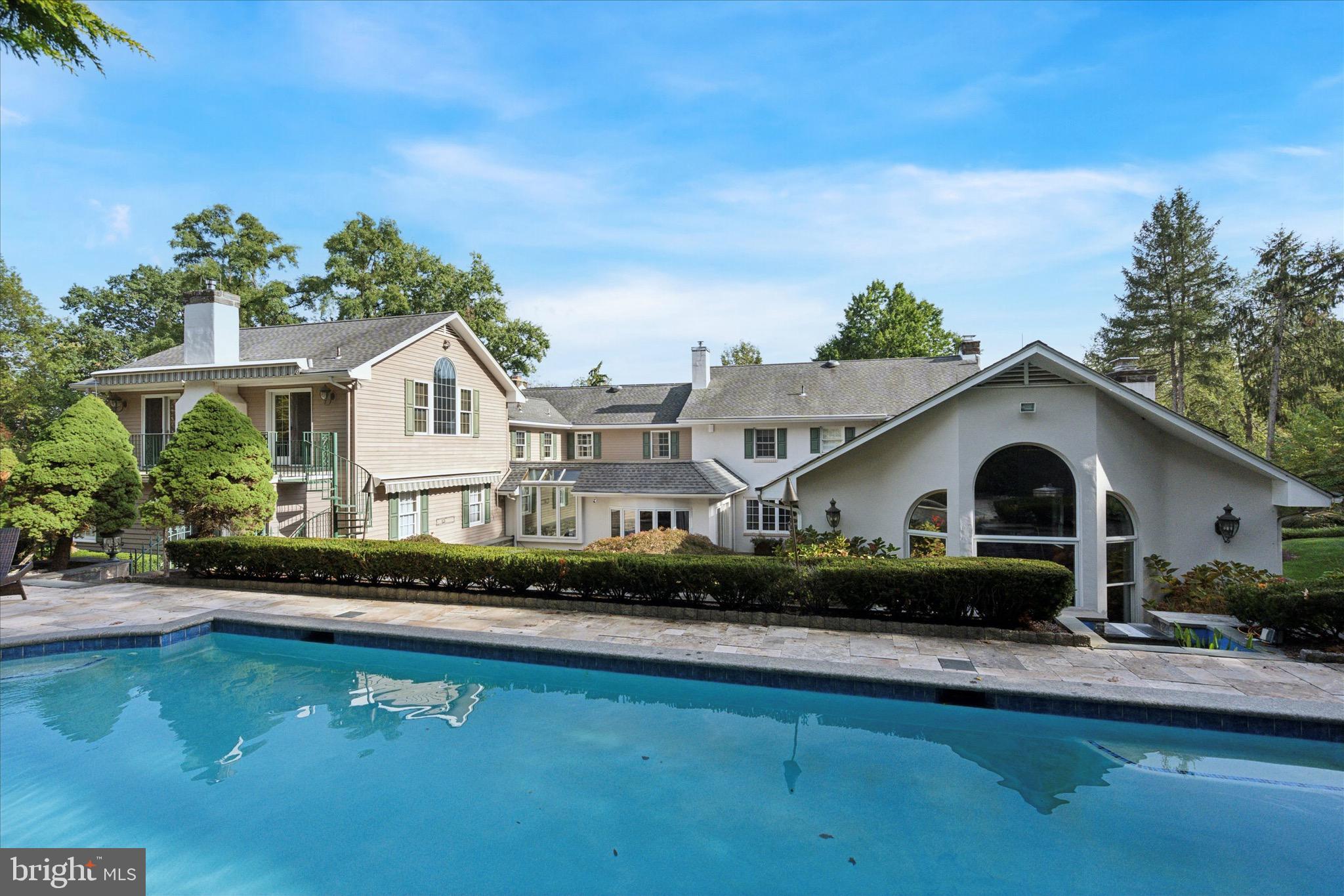 1087 Mt Eyre Road Washington Crossing, PA 18977 - Photo 21 of 77 a front view of a house with a garden and plants