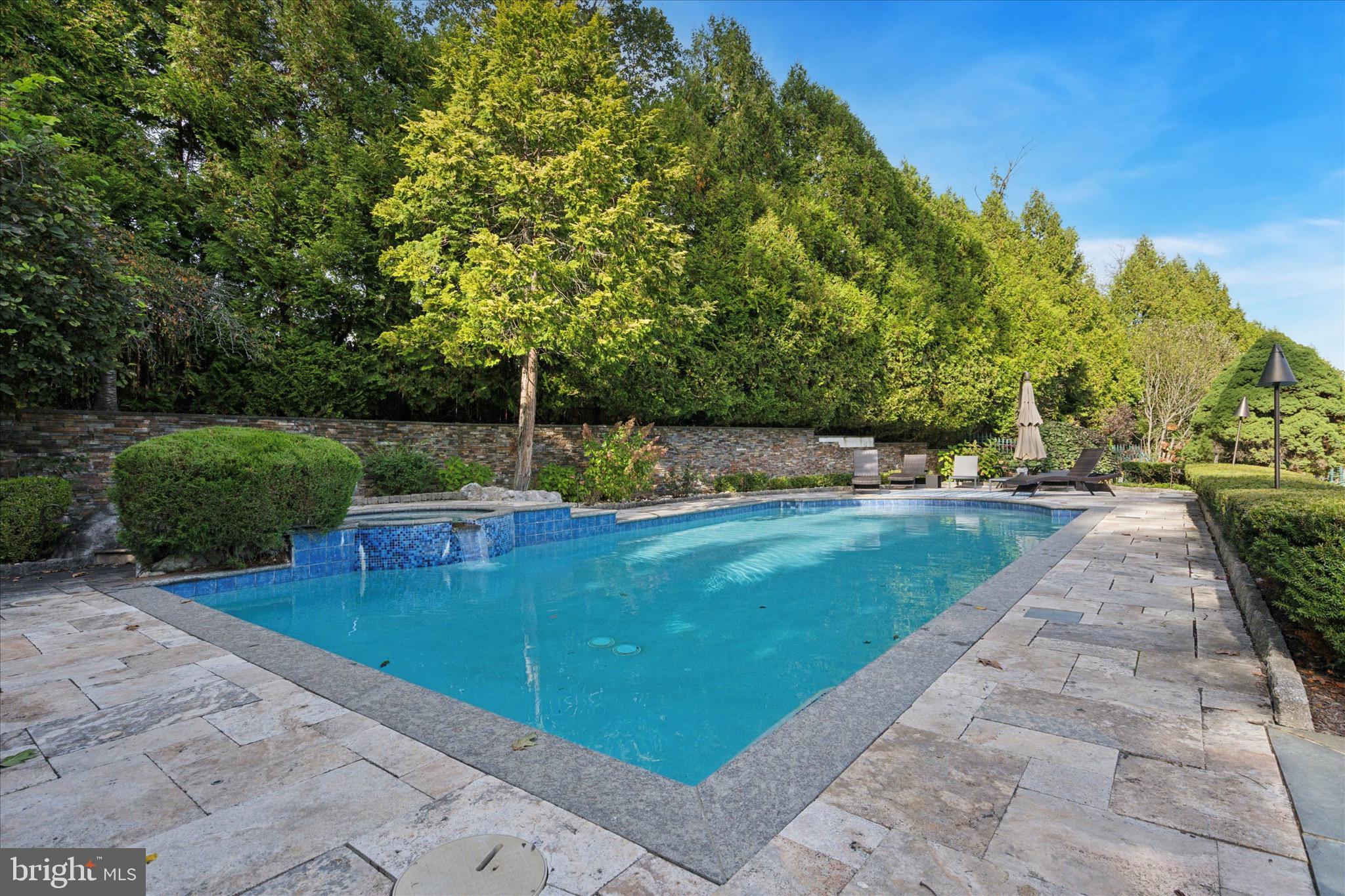 1087 Mt Eyre Road Washington Crossing, PA 18977 - Photo 23 of 77 a view of a backyard with lawn chairs plants and large tree