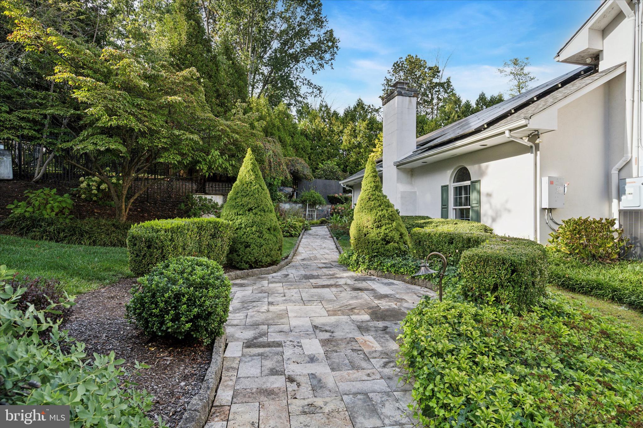 1087 Mt Eyre Road Washington Crossing, PA 18977 - Photo 26 of 77 a view of backyard with potted plants and a large tree